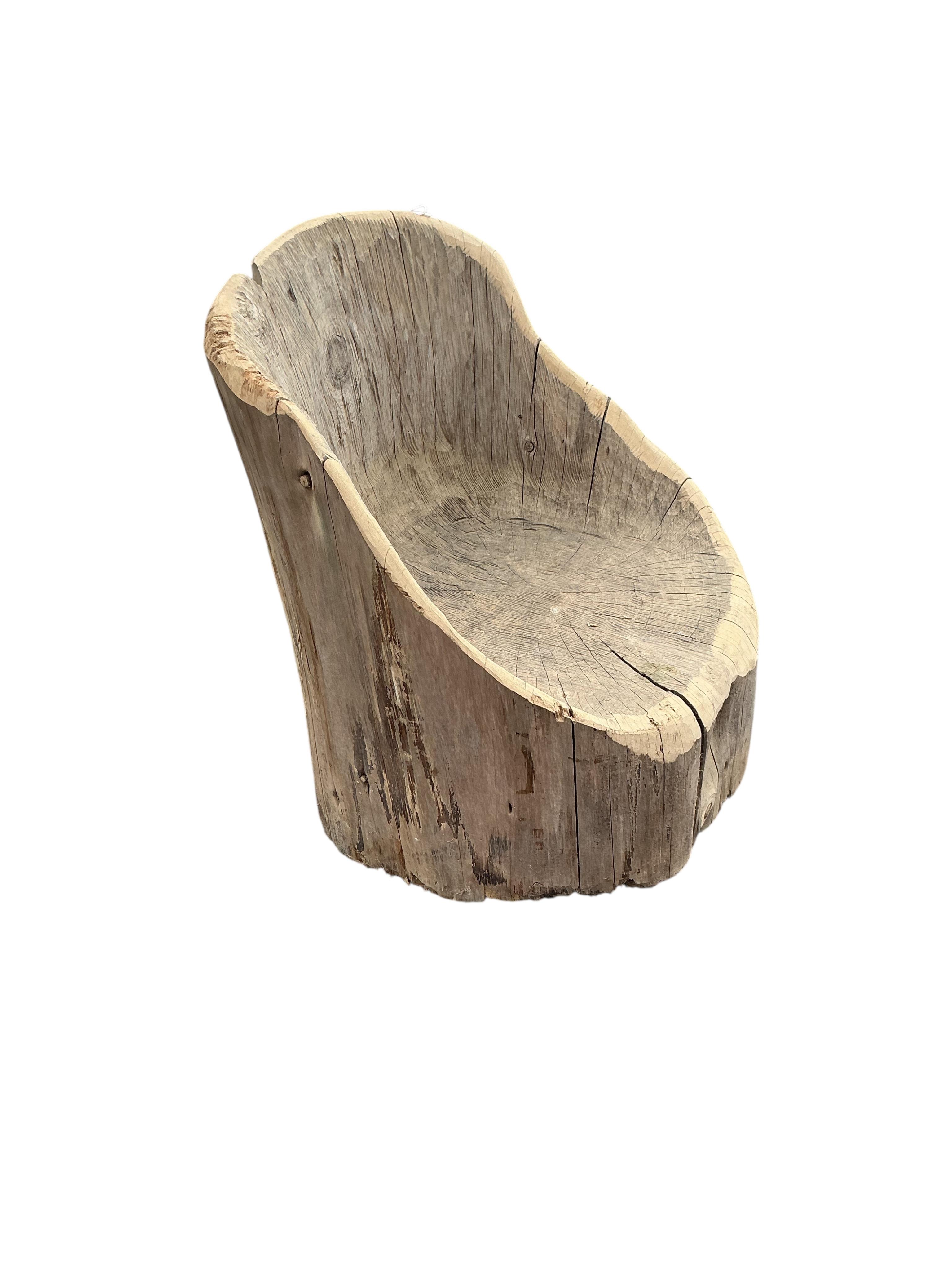 An elm tree section garden seat, width 46cm, height 62cm